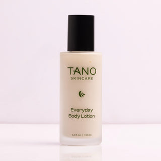 TANO Skincare Everyday Body Lotion bottle on a light pink background