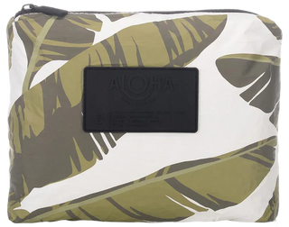 Pouch with leaf pattern and black label on a white background